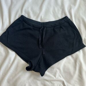 Black waffle knit pajama/lounge shorts.